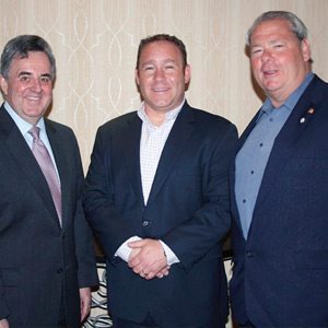Long Island Water Conference Chairman Michael Levy (c.) presents Port Washington Water District Water Commissioners David Brackett (l.) and Peter Meyer with a plaque to honor Port Washington Water District Centennial at the Long Island Water Conference meeting.