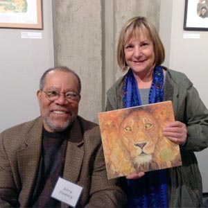 Author/illustrator Jerry Pinkney with library patron Nancy Graham.