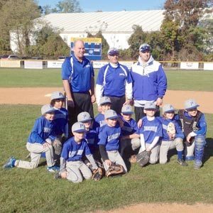The undefeated team, (seated, l. to r.) Owen Schindler, Carlos Stolper, Ethan Rotko, Isaac Harris, Benjamin Tesman, Paul Cavounis, Michael Andrew, Noah Schissel, Tal Schulmiller, Daniel Alexander. Standing: coach Ed Andrew, manager Michael Schissel, coach Donald Alexander. Not pictured: Ethan Wofse.