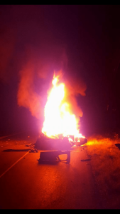 The flames from the car fire are what initially drew the attention of the three heroes. (Photo by David Gurfein)