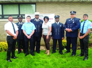 Hempstead Town Clerk Nasrin Ahmad (center) with members of the South Floral Park Fire Department.
