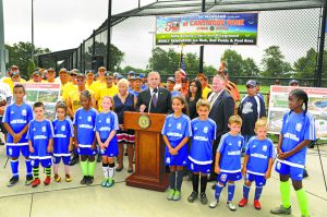 Nassau County Ed Mangano speaks at the Cantiague Park ceremony to mark the county park's 50th anniversary and the recent improvements. To his right is Legislature Rose Marie Walker