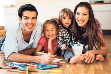 Young happy family drawing