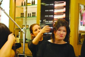Perri Silverstein gets her hair done by a stylist as part of a free makeover from Lord & Taylor in Garden City. 