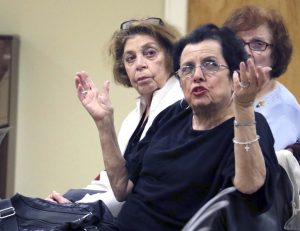 Louise LaGatta makes a point about the existing traffic problems in the area around the Hicksville Sears store, while Mary Garone, behind her, waits her turn to speak at the Hicksville Community Council meeting on May 5. Both speakers foresaw even worse congestion if the plans proposed by the owners of the Sears property came to pass. (Photo by Frank Rizzo)