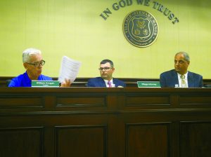 Village of Stewart Manor trustee William Grogan (far left) declaring the board’s disagreement with Mayor Gerard Tangredi over a recent employee hire. (Photos by Chris Boyle)