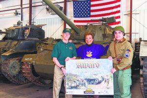 Kevin Carroll (left) and Jim Oliveri of The Museum of American Armor present the American Heritage Award to Stop & Shop’s Arlene Putterman in recognition of the Hicksville Stop & Shop’s sustained support of programs that honor those who have worn our nation’s military uniform.