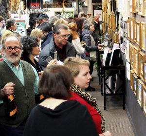 Al Trapani (far left) at an event held at the Manhasset Trapani Art & Frame location