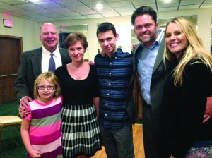 Laura DeStefan (far left), receives her new hearing aids from funds raised at the Night of Musical Talent even, pictured with (from left) Kurt, Debbie and Kyle Meyfohrt, Justin and Kristi Osmond. (Photo by Dr. Cynthia Paulis)