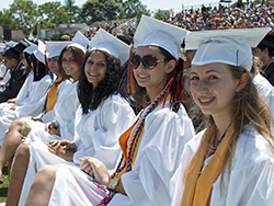 Members of the Class of 2013 wait their turn to be called to the podium to be congratulated and receive their diplomas. hicksville 2013 07 26 grada