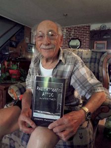 Long Island Writers Guild co-founder and Levittown resident Joe Pantatello showing off his short story anthology Robertson’s Attic. (Photos by Chris Boyle)