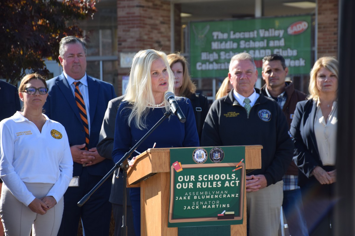 Locust Valley Central School District superintendent speaking against regionalization at a rally in October