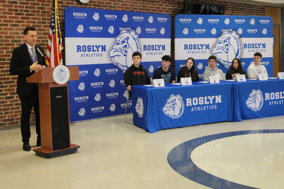 Student athletes at Roslyn High School commit to their college's sports teams