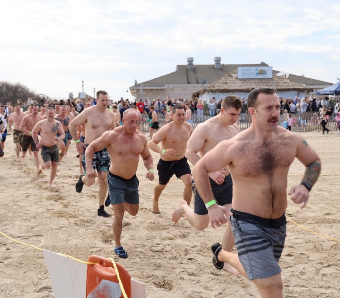 Community members heading to the Tobay Beach waters during the Town of Oyster Bay's Polar Plunge on Saturday, March 29