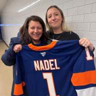 Town of North Hempstead Council Member Mariann Dalimonte poses with the New York Islanders' Community Hero of the Month, Emma Nadel, for her work in the community's volunteer fire house and police force.
