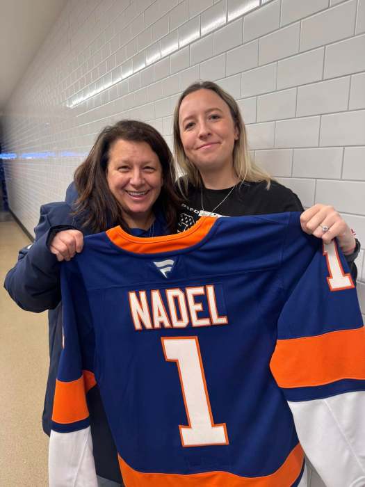 Town of North Hempstead Council Member Mariann Dalimonte poses with the New York Islanders' Community Hero of the Month, Emma Nadel, for her work in the community's volunteer fire house and police force.