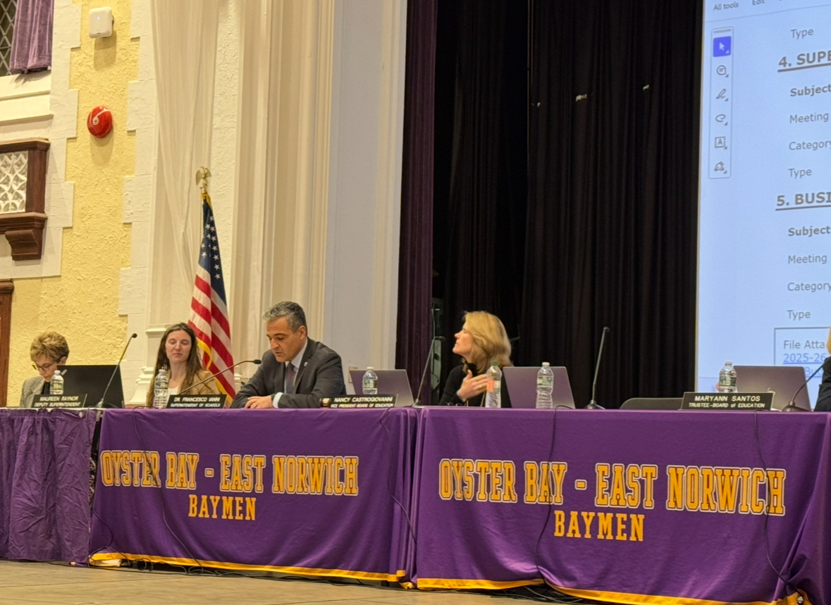 Maureen Raynor (center L.) and Francesco Ianni (center R.) at the Oyster Bay-East Norwich Board of Education meeting on Tuesday, March 25