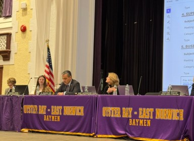 Maureen Raynor (center L.) and Francesco Ianni (center R.) at the Oyster Bay-East Norwich Board of Education meeting on Tuesday, March 25