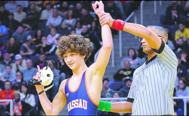 Colton Schmiesing placed no. 1 in the state wrestling championships, earning the first title in Oyster Bay High School wrestling program history