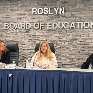Roslyn Board of Education President Meryl Ben-Levy discusses decreaes in state aid with members of the board of education.