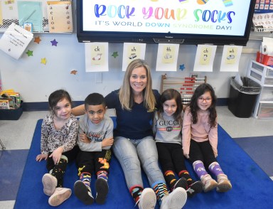 Teacher Christine Zinkiewicz was joined by students who wore their crazy socks to school in celebration of uniqueness in the Massapequa School District