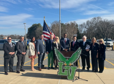 Superintendent Kristen Turnow, Lieutenant Governor Antonio Delgado and Assembly Member Jake Blumencranz (L. to R., behind the podium) are gathered by officials from Locust Valley and neighboring districts to discuss civic education on Friday, March 25