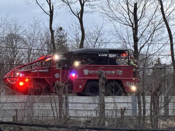 East Norwich brush fire truck responds to fire near LIRR tracks in East Hills.