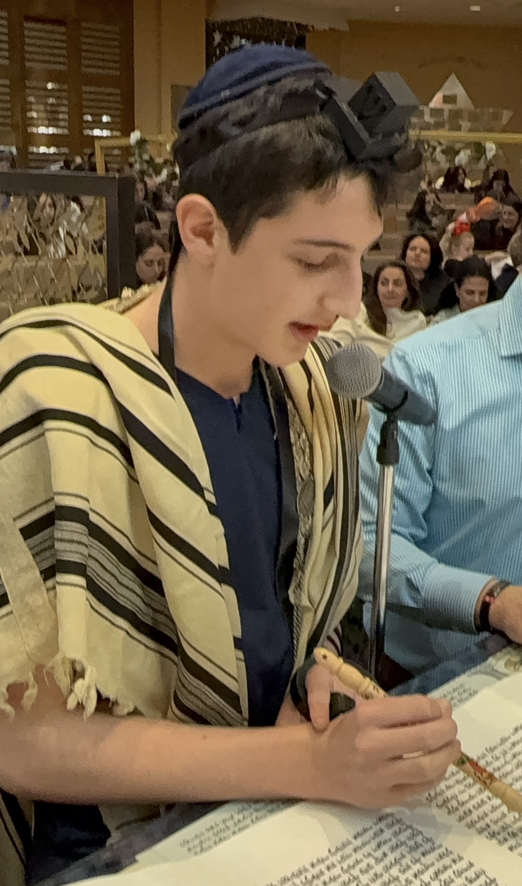 Jeremy Brownstein reading his portion of the Megillah