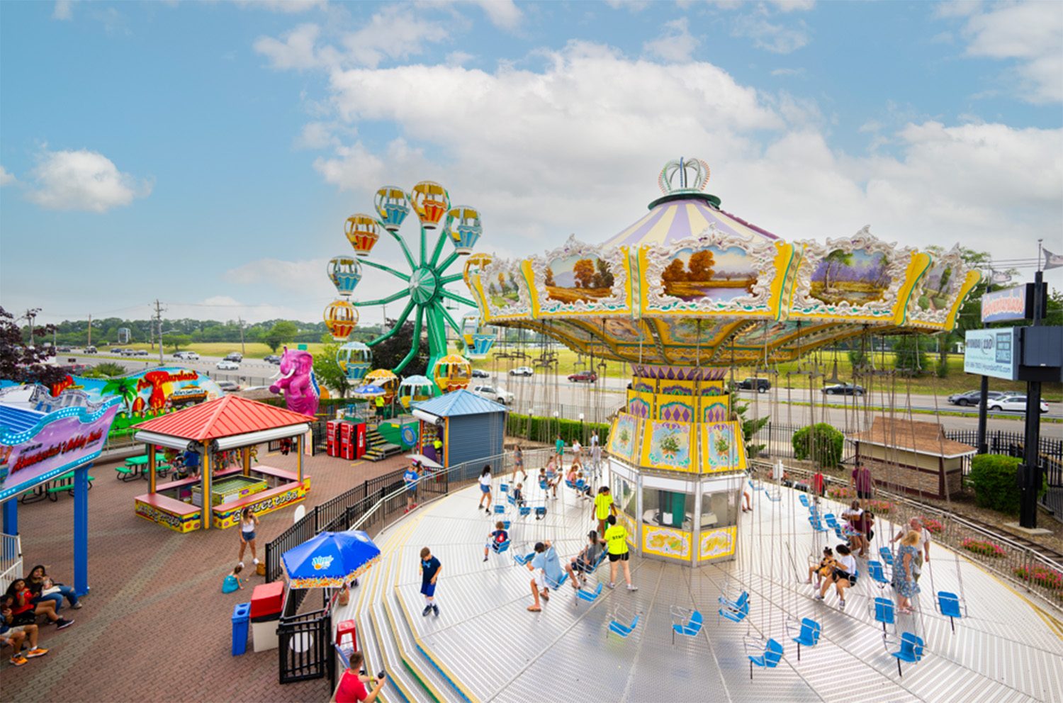 A view of Adventureland’s iconic Wave Swings and Ferris wheel.