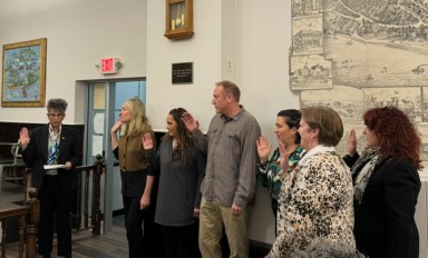 Mayor Elena Villafane (L.) appoints Sea Cliff village volunteers to their positions at the Monday, April 7, organizational meeting