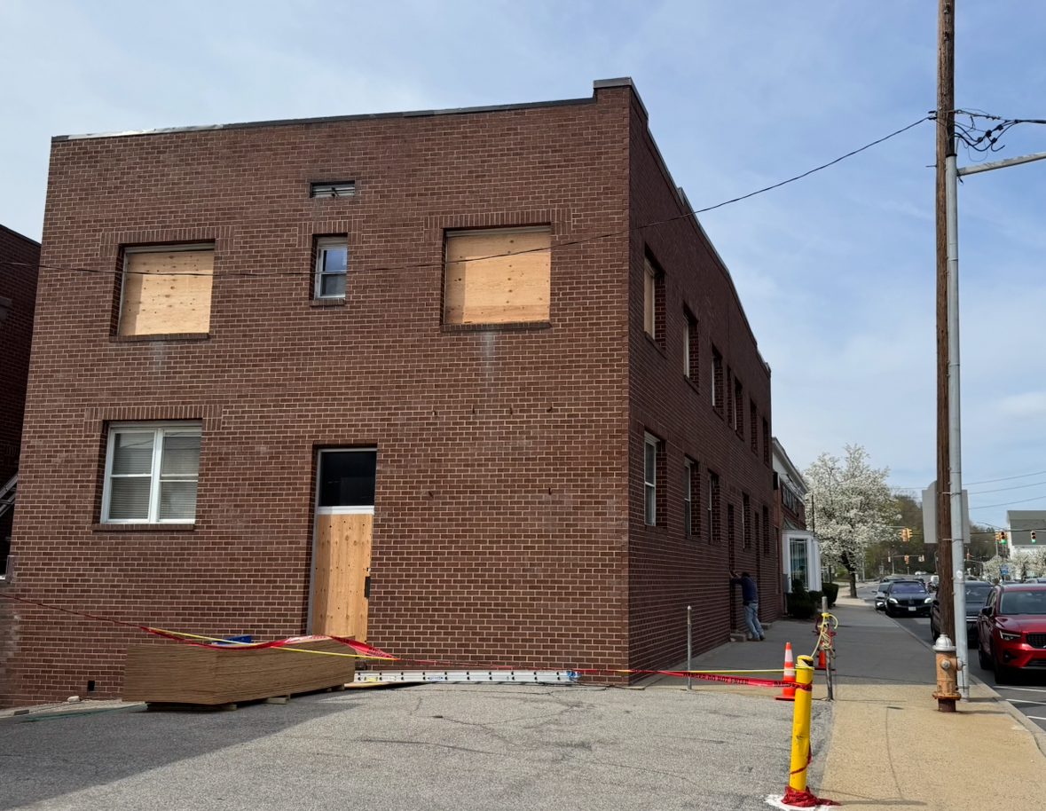 After a fire broke out in the early morning of Thursday, April 17, windows and doors were boarded up, and caution tape blocked off the entrance to 68 Glen Cove Ave.