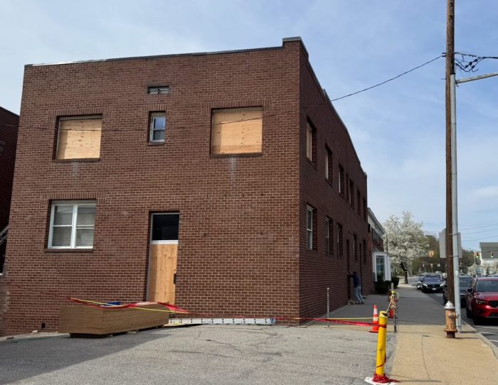After a fire broke out in the early morning of Thursday, April 17, windows and doors were boarded up, and caution tape blocked off the entrance to 68 Glen Cove Ave.