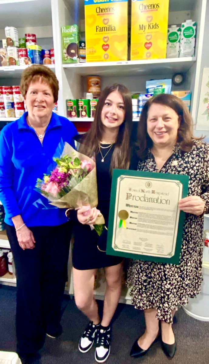 North Hempstead Council Member Mariann Dalimonte (right), honored Port teen Summer Karpf (center) for her work on the food insecurity initative 'Port Feeding Port.'