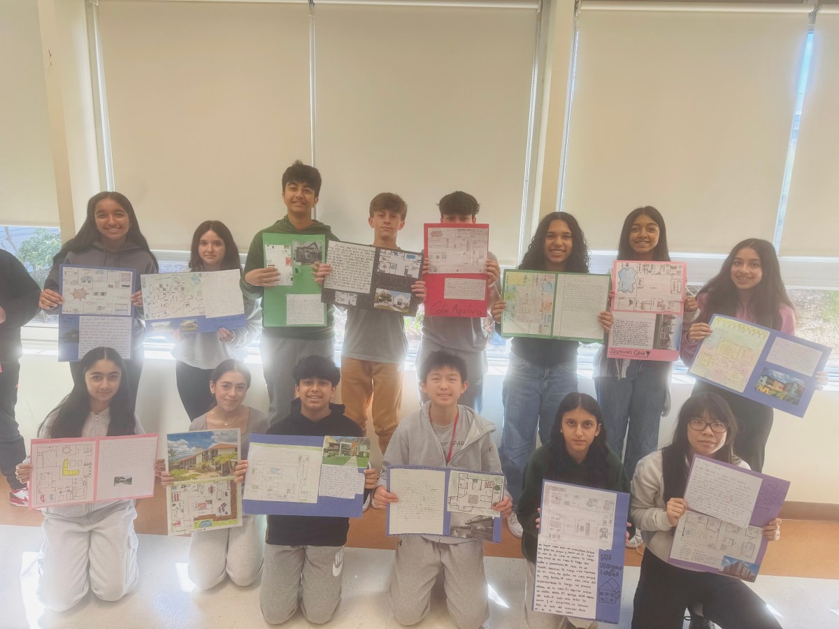 Wheatley students stand with certificates.