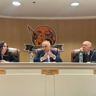 Mineola's Board of Trustees sits and speaks at their Wednesday meeting.