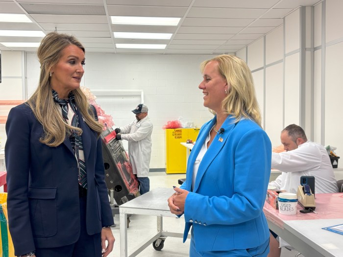 (L-R) Kelly Loeffler and Anne Shybunko-Moore in a clean room.