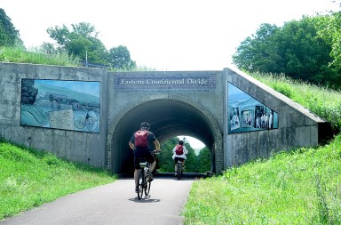 Biking the Great Allegheny Passage trail with Rails to Trails Conservancy. The trail is part of the Great American Rail-Trail that ultimately will create a transcontinental network of trails 3,700 miles from Washington DC to Washington state. Find a trail near you on Celebrate Trails Day, April 26. © Karen Rubin/goingplacesfarandnear.com
