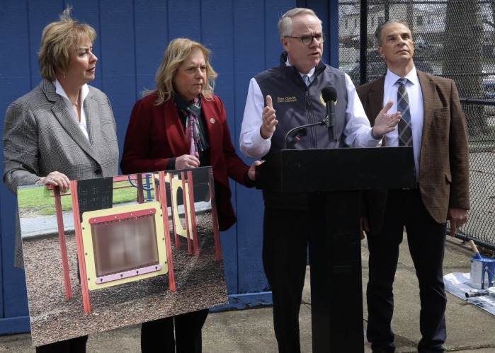 Town of Hempstead Supervisor Don Clavin (2nd from R.) speaking about cleaning up swastika graffiti in Hempstead parks.