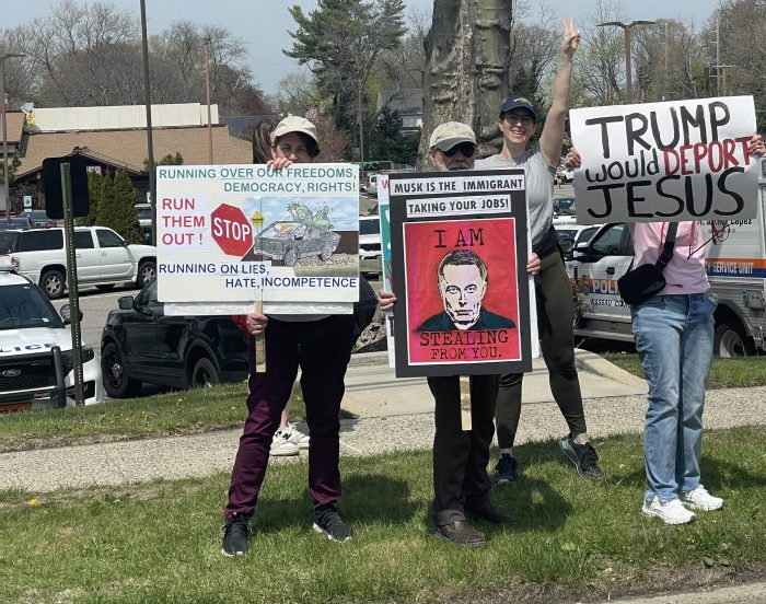 Protestors at the April 19 Tesla Takedown protest in Manhasset