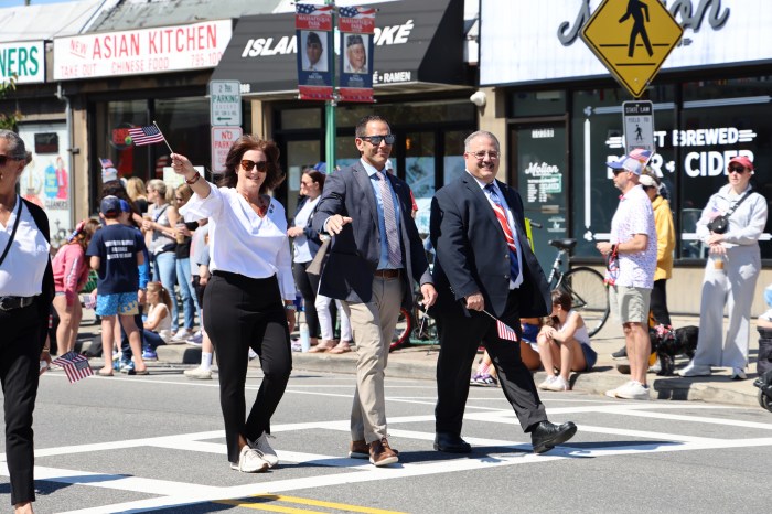 Massapequa Park Trustee Christine Wiss, state Assembly Member Michael Durso and Massapequa Park Mayor Daniel Pearl (L. to R.) marching in the parade