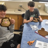 Berner Middle School students Jack Cohen (L.) and Andrew Bacheller (R.) worked on their sewing projects, a monkey and a sloth, respectively.