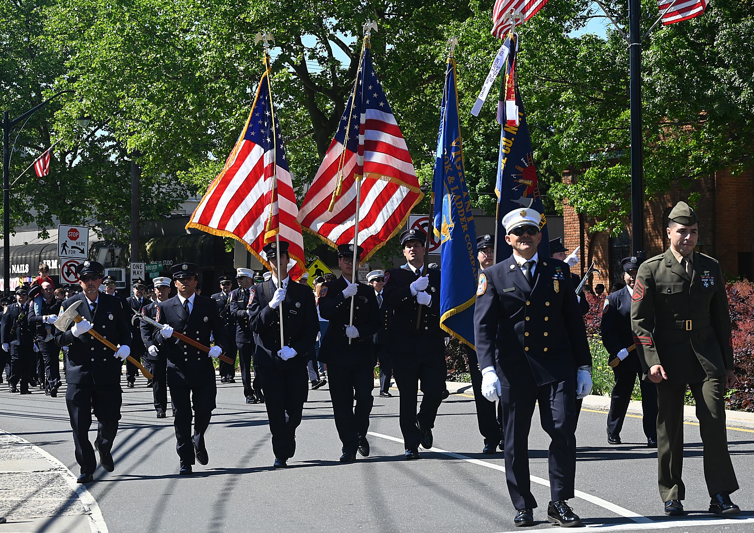 Great Neck firefighters march in the Memorial Day parade.
