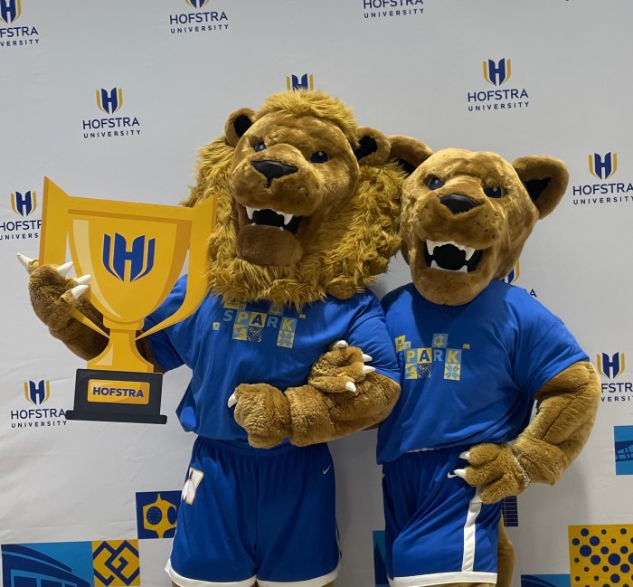 Hofstra University's mascots, Kate and Willie Pride, pose with the school's new logo ahead of it's centennial celebration.