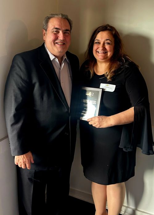 Plainview-Old Bethpage Middle School Assistant Principal Dorothy Drexel (R.) and her husband Raymond Drexel (L.) after she was honored for time as an administrator