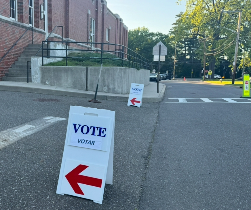 A sign outside of Oyster Bay Middle/High School directs voters to the polls