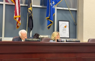Glen Cove Mayor Pam Panzenbeck (R.) responds to resident concerns at the council meeting.