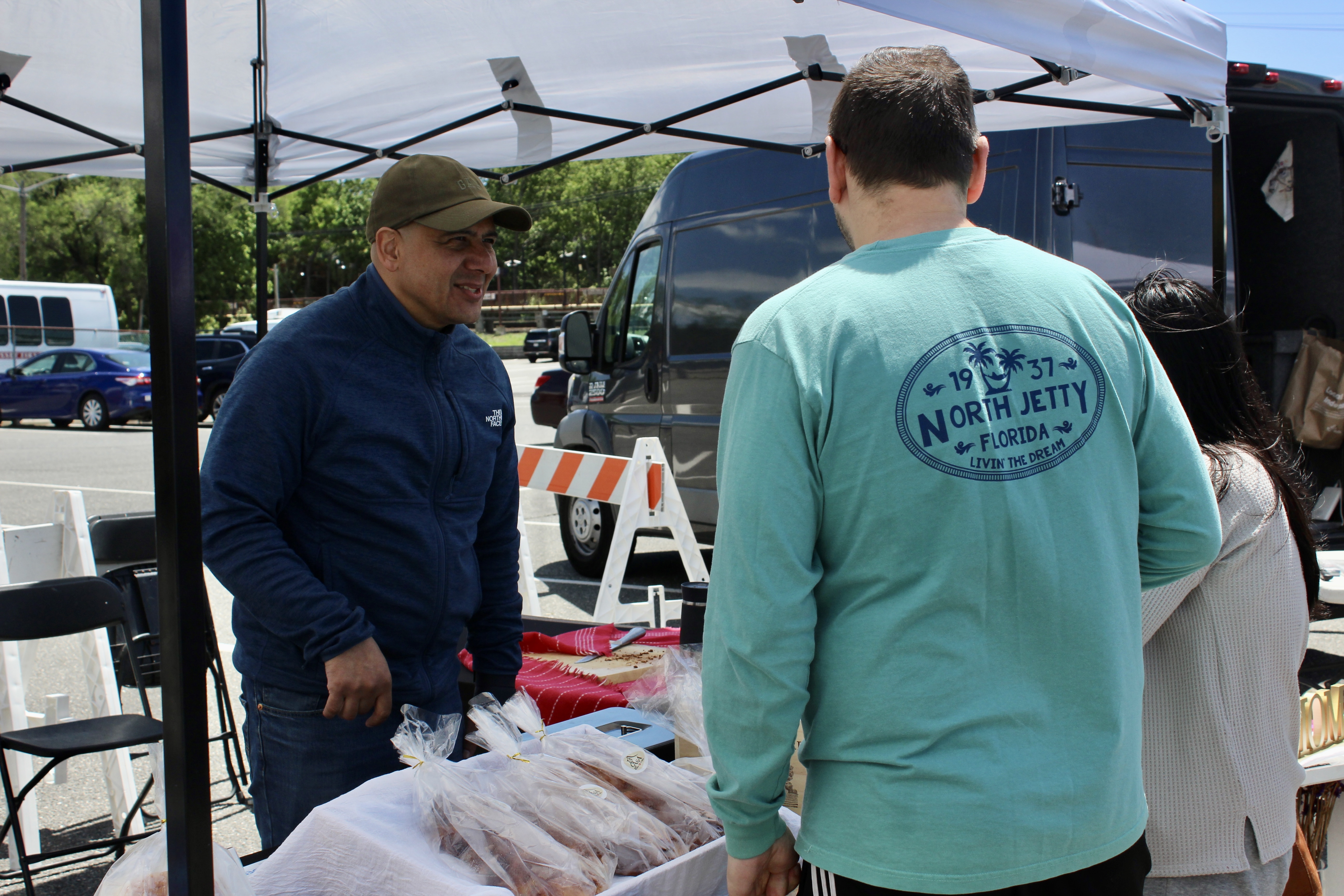 A vendor sells breads and baked goods.