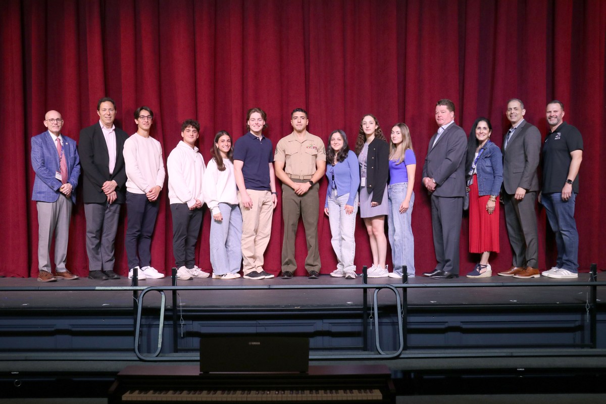 Members of the Great Neck North High Support Our Troops club and school district members with Staff Sgt. Carlos E. Gallo Jr.
