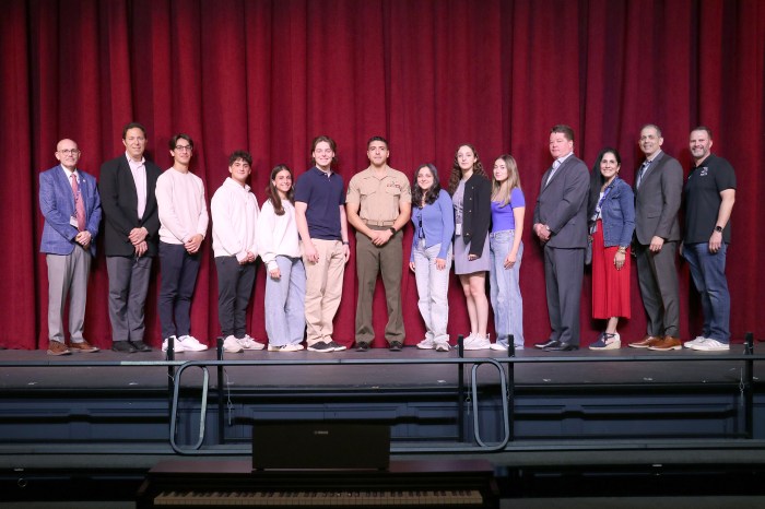 Members of the Great Neck North High Support Our Troops club and school district members with Staff Sgt. Carlos E. Gallo Jr.
