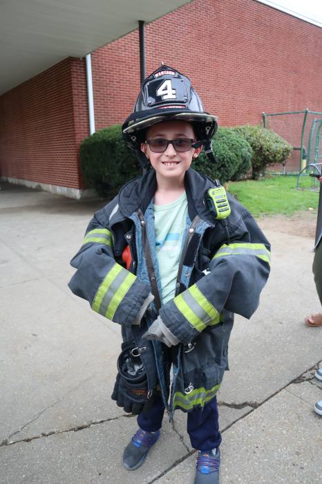 Student Luca Vacchio donned a firefighter’s gear during career day